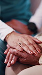 Elderly, woman and holding hands in nursing home with caregiver, understanding and compassion for loss. Nurse, senior person and comfort in retirement with support, kindness and console for grief.
