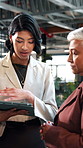 Business, tablet or team in office with discussion, portfolio review or feedback on investment strategy. Forecasting, women or finance advisors with tech, funding plan or insight on budget evaluation