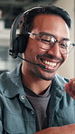 Businessman, consultant or speaking with headset in office for customer service or telecommunications. Happy man, employee or friendly agent talking with smile or mic for online advice in workplace