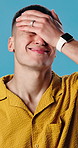 Stress, fail and man in studio for regret, mistake or error with university application rejection. Upset, disappointment and person with bad decision for student loans at college by blue background.