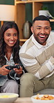 Happy, playful and couple on sofa for video games, online competition and playing together for bonding. Home, dating and man with woman with controller for entertainment, virtual challenge and fun