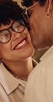 Love, woman or couple with cheek kiss, partner connection or bonding together in living room. Smile, tender or people in house with affection, romantic moment or commitment in happy relationship.