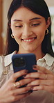 Smile, woman and texting with phone in home for dating app, message response and notification. Happy, girl and mobile website in apartment with profile match, reading contact bio or online connection