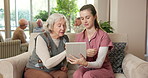 Senior, nurse and talking with tablet in retirement home for medical schedule or prescription. Female person, healthcare worker or caregiver with technology for elderly care, app or health checkup