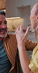 Argument, upset and couple on sofa in home for divorce, cheating or toxic marriage in living room. Fighting, conflict and mature man with woman for breakup, affair or disagreement in apartment.