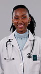 Face, black woman and doctor in studio, healthcare expert and laughing on white background. Smile, medical professional and person with confidence for wellness, funny physician and career integrity