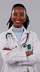 Face, woman and doctor with confidence in studio, healthcare expert or laugh on white background. Smile, medical professional and black person with arms crossed for wellness, funny physician or pride