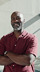 Face, business and black man in office with arms crossed, career pride and about us for copywriting. Portrait, mature person and smile in workplace with ambition, news reporter and public relations