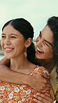 Beach, vacation and happy lesbian couple with hug, bonding together and conversation for getaway. Lgbt women, smile and embrace outdoor by ocean with romantic relationship, love and summer holiday.