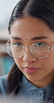 Thinking, glasses and business woman in office on tech for finance proposal, planning and investment. Corporate, reading and Asian person on computer for problem solving, financial report or solution