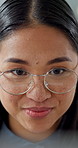Thinking, happy and business woman in office on tech for finance proposal, planning and investment. Corporate, glasses and Asian person on computer for problem solving, financial report or solution