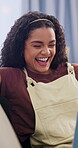 Laptop, laughing and relax with woman on sofa in home living room for entertainment streaming. Break, computer and funny with happy person in apartment for comedy, subscription service or movie