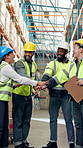 Happy, people and hands together with team in warehouse for logistics, unity or support in depot. Excited, group or employees piling with smile or stack for supply chain mission, success or winning