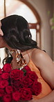Kiss, couple and flowers at restaurant with love, surprise or gift for valentines day celebration. Happy woman, man and roses on date with shock, romantic present or smell bouquet with gratitude