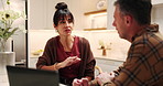 Kitchen, couple and discussion for debt, finance planning or asset management with laptop for savings. Budget, mature man and woman in home for expenses, talking and feedback for mortgage cost