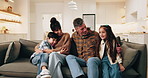 Parents, children and sofa with hug in home for comfort, bonding or weekend together. Mom, dad or kids relaxing with smile or embrace on living room couch for family time, holiday or break in house