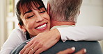 Happy, hug and caregiver with senior man in home for support, comfort or good news on treatment. Smile, healthcare and medical worker embracing elderly patient for trust at consultation in house.