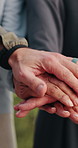 Outdoor, people and hands together with personal trainer for fitness, support and health celebration. Nature, teamwork and huddle with stack for solidarity, exercise goal or motivation for wellness