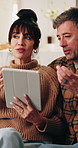 Happy, talking and couple on tablet for planning, online shopping and decision for interior decor. Marriage, home and mature man and woman on tech for research, website and bonding in conversation