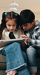 Children, relax and reading in home with tablet, browsing and download ebook for education. Family, kids and streaming in lounge with digital, watching video and educational games for online learning