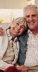Love, face and senior couple in home with hug, marriage commitment and healthy relationship. Pensioner portrait, happy people and embrace in house for bonding together, retirement support and loyalty