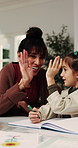Mom, child or teaching with high five in home for mathematics, homework or tutoring daughter. Mother, student or kid writing with smile or book for learning success or childhood development in house