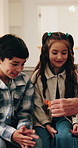 Toys, playing and grandpa with kids on sofa for bonding, connection and playful relationship. Family, happy and excited children with dinosaurs, games and relax with grandfather on weekend in home