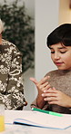 Homework, grandmother and child with counting in home for math, problem solving or learning support. Homeschool, family and kid with book for education, activity help and writing answer for equation