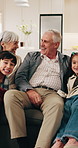 Happy, grandparents and talking with kids in home for conversation, bonding or relaxing together. Grandma, grandpa and discussion with children, hug or family break for holiday or weekend in house
