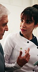 Caregiver, tablet and old man in retirement home with discussion, medical advice or tips for wellness. Senior person and healthcare worker with tech, opinion and recommendation for disease diagnosis.