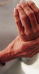 Senior woman, hands and wrist pain with injury in home for arthritis or carpal tunnel syndrome. Closeup, elderly or female person with sore arm for joint inflammation or muscle tension in house