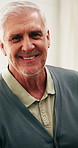 Senior, face and man with smile in home for retirement holiday, weekend or healthcare. Portrait, happy or male person relaxing with pride for health, wellness or pension break in old age house