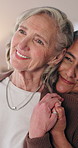 Lesbian, thinking or couple in home with holding hands, love or marriage reflection on weekend break. Flashback, smile or mature women with nostalgia, LGBTQ connection or calm mindset in relationship