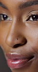 Thinking, woman and makeup in studio for beauty, foundation glow and change for clear skin. Closeup, African person and cosmetics for facial transformation, makeover and aesthetic on gray background