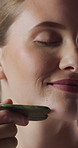 Facial massage, skincare and woman with gua sha, glow and smile with anti aging benefits and beauty. Dermatology, wellness and happy person with cosmetic tool for healthy skin, self care and shine