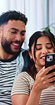 Smile, couple and relax at house with phone, social media or browsing website for online shopping. Happy, people and talking in lounge with mobile, checking catalog and app subscription for ecommerce