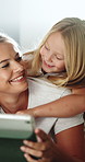 Happy child, hug and mom with tablet on bed, entertainment and streaming movie with app subscription. Family, online and woman with technology on break, love and watch film with kid and relax in home