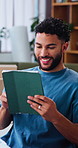 Tablet, ecommerce and happy man in home, small business and reading review on online store. Smile, technology and person with distribution email, supplier update and freelance dropshipping service