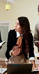 Business woman, laptop and discussion in office, team meeting or presentation brief with tasks. Mature leader, technology and documents for pitch, agenda or schedule for productivity in collaboration