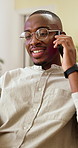 Phone call, discussion and happy man with glasses in business, headhunter and chatting with contact. Recruiter, smile and black person with mobile, communication and planning for interview in office