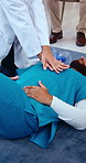 CPR, hands and doctor training with nurse for healthcare, first aid practice and emergency rescue. Medical people, chest compression and demonstration for nursing course or teaching at hospital