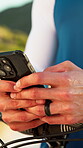 Hands, phone and bike in nature for fitness, location search and distance tracking on training app. Person, bicycle and outdoor with mobile for typing, online cycling map and change GPS settings