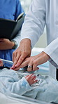 Doctor, hands and baby doll for cpr, nurse training and teamwork or research in clinic. Healthcare group, people or pediatrician mentor with child model for internship, collaboration or discussion