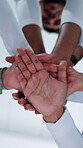Below, hands and stack with business people in office together for motivation or support. Palm, solidarity and team building with employee group in corporate workplace for opportunity or success