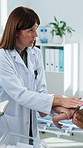 Doctor, first aid or training with baby mannequin, back blows or demonstration with nurse. Woman, medical pediatrician or infant doll for choking safety, life saving or learning with notes in clinic