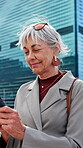 Business, texting or woman in city with phone, message response or networking on chat app. Happy, contact or mature employee outdoor with tech, digital communication or email feedback in windy town.