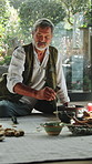 Smoke, herbs and man with natural ritual for mindfulness, healing and culture with flame. Zen, incense and person in ceremony with alternative medicine with spiritual energy, aromatherapy or cleanse