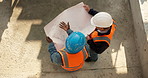 Architect, ideas and team with blueprint on construction site, discussion or planning for renovation. Civil engineering, above and people with paperwork for property development and collaboration