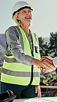 Construction, forest and people with handshake for timber, manufacturing and wood harvesting. Contractor, outdoor and woman shaking hands for agreement, meeting and partnership for excavation project