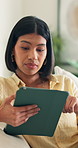 Home, woman or research with tablet on sofa for interior design, renovation or ideas for improvement. Female person, relax or scrolling with technology for furniture, DIY tips or online tips in house
